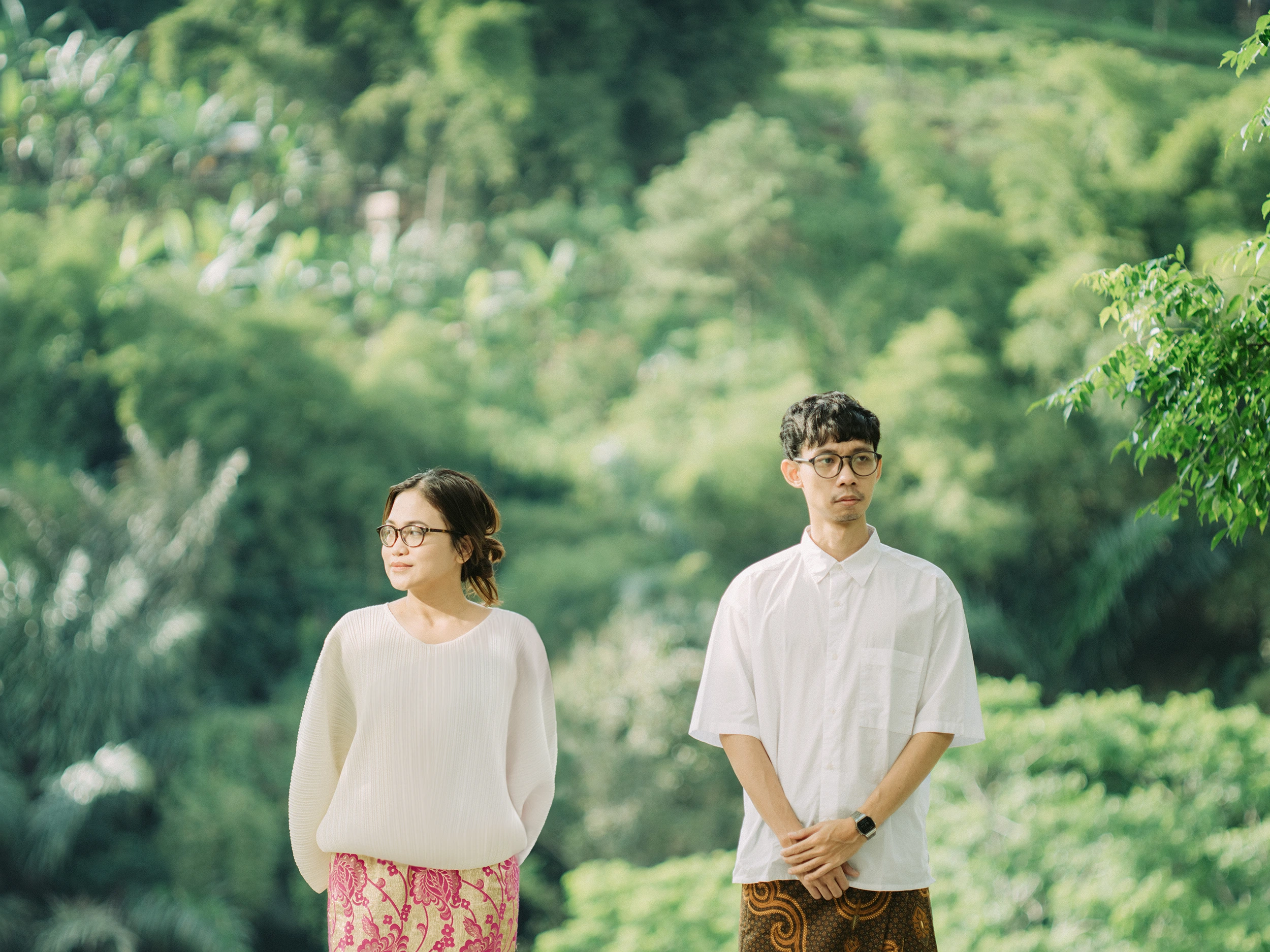 Yola and Asto standing in a garden